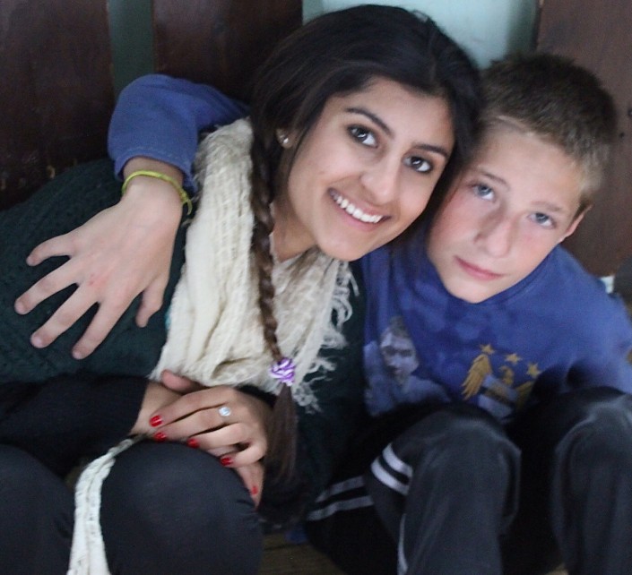 Sahar and a young Bosnian boy (Photo courtesy of Sahar Afrakhan)